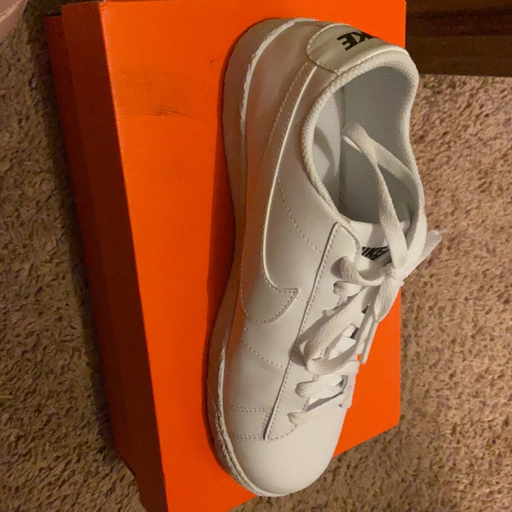 All white Nike shoes
